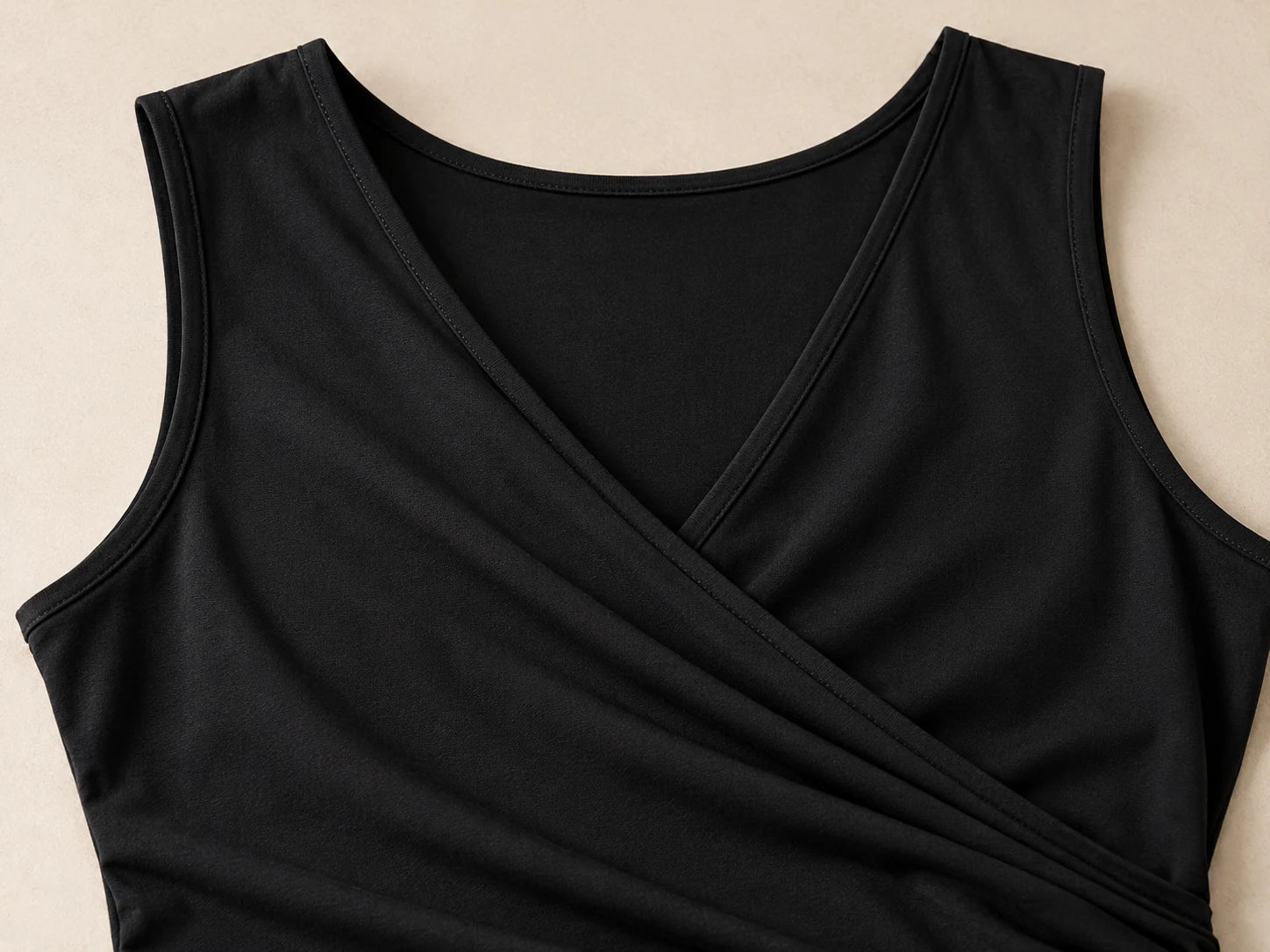 Sleeveless Wrap Top, Black: Neckline detail; AI design preview, not verified merchandise evidence