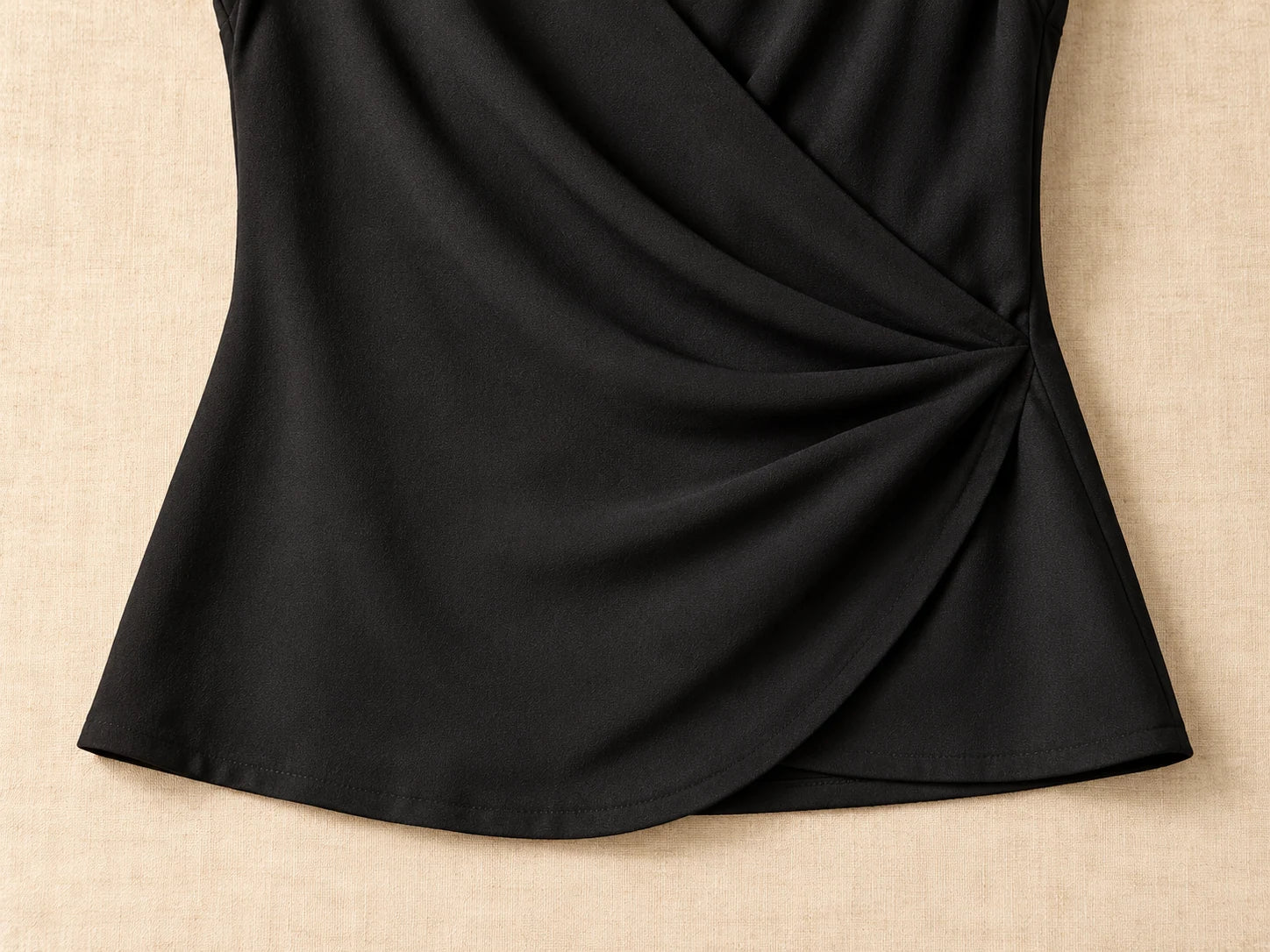 Sleeveless Wrap Top, Black: Hem detail; AI design preview, not verified merchandise evidence