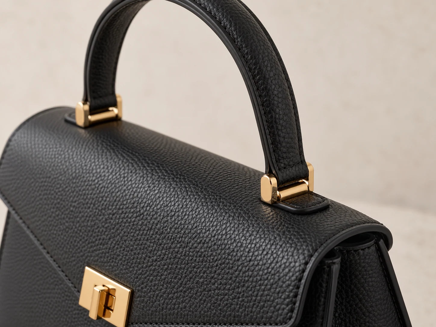 Structured Leather Bag, Black: Handle detail; AI design preview, not verified merchandise evidence