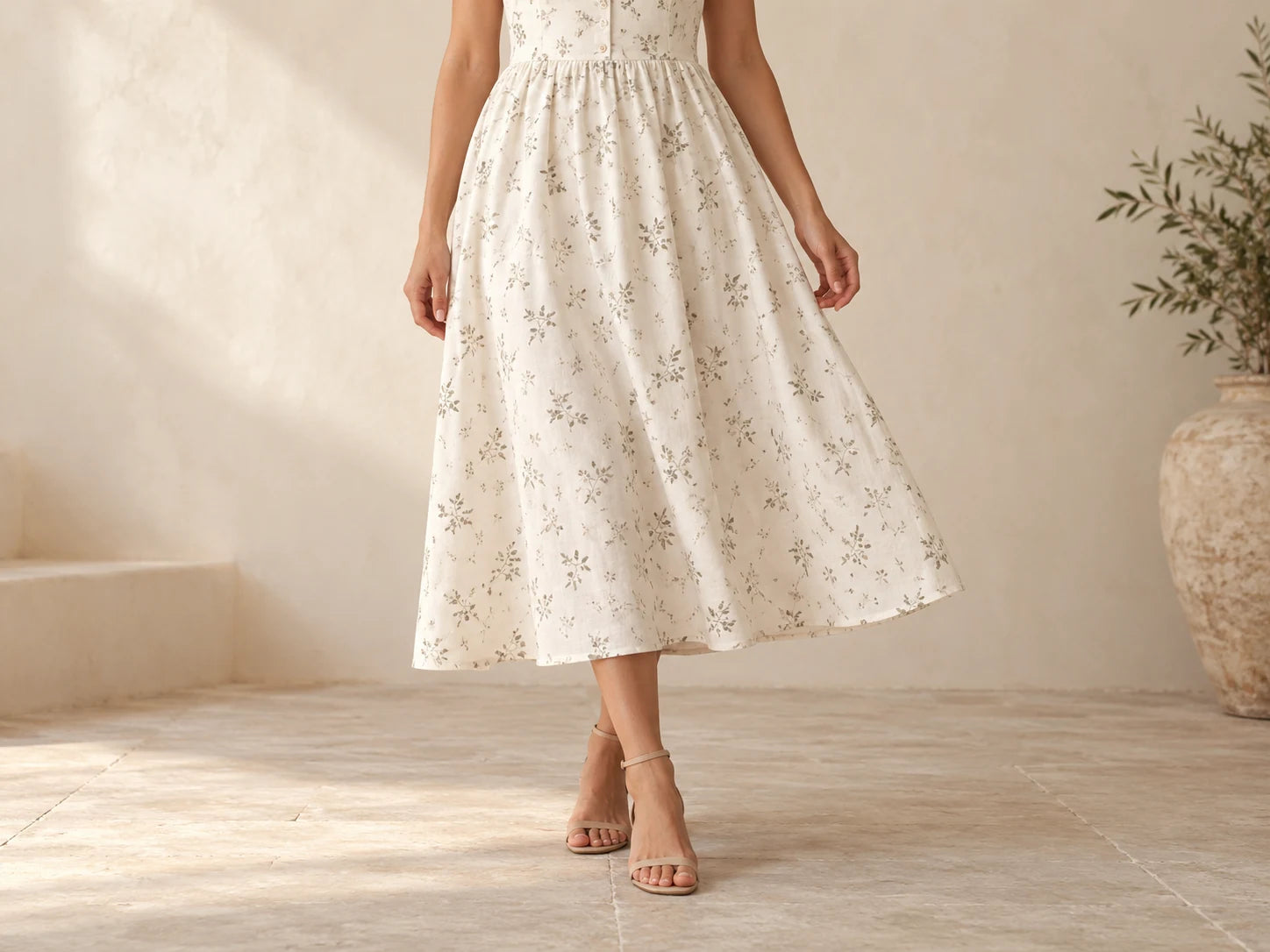 Linen Midi Dress, Ivory botanical: Hem detail; AI design preview, not verified merchandise evidence