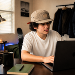 Person wearing the khaki quick-dry duckbill cap