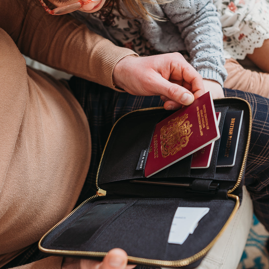 Family preparing travel documents with the passport organiser